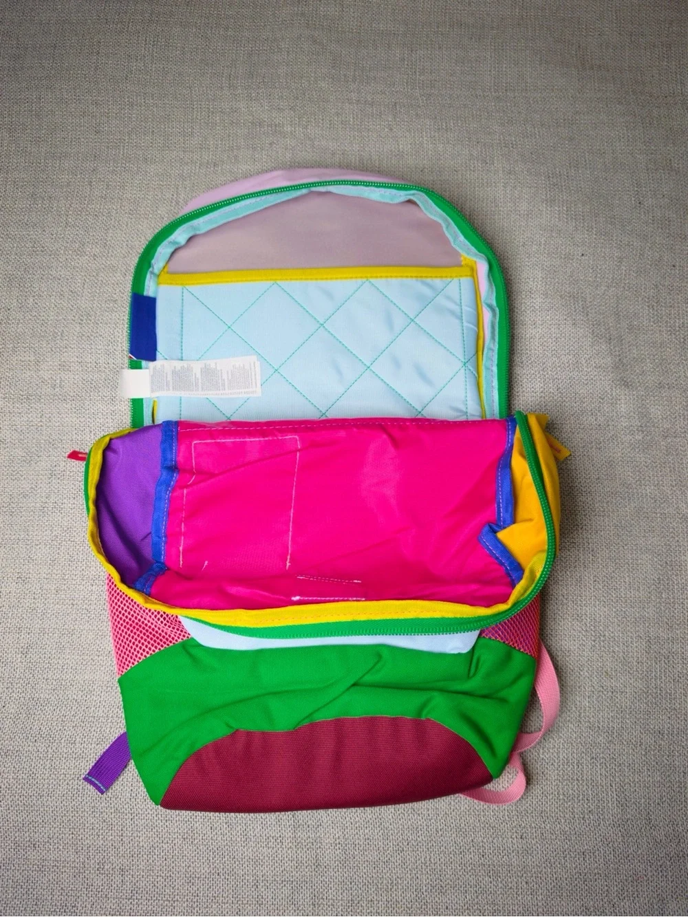 cotopaxi Kids Backpack in Pink, Light Blue, Green, Yellow, Purple, Red